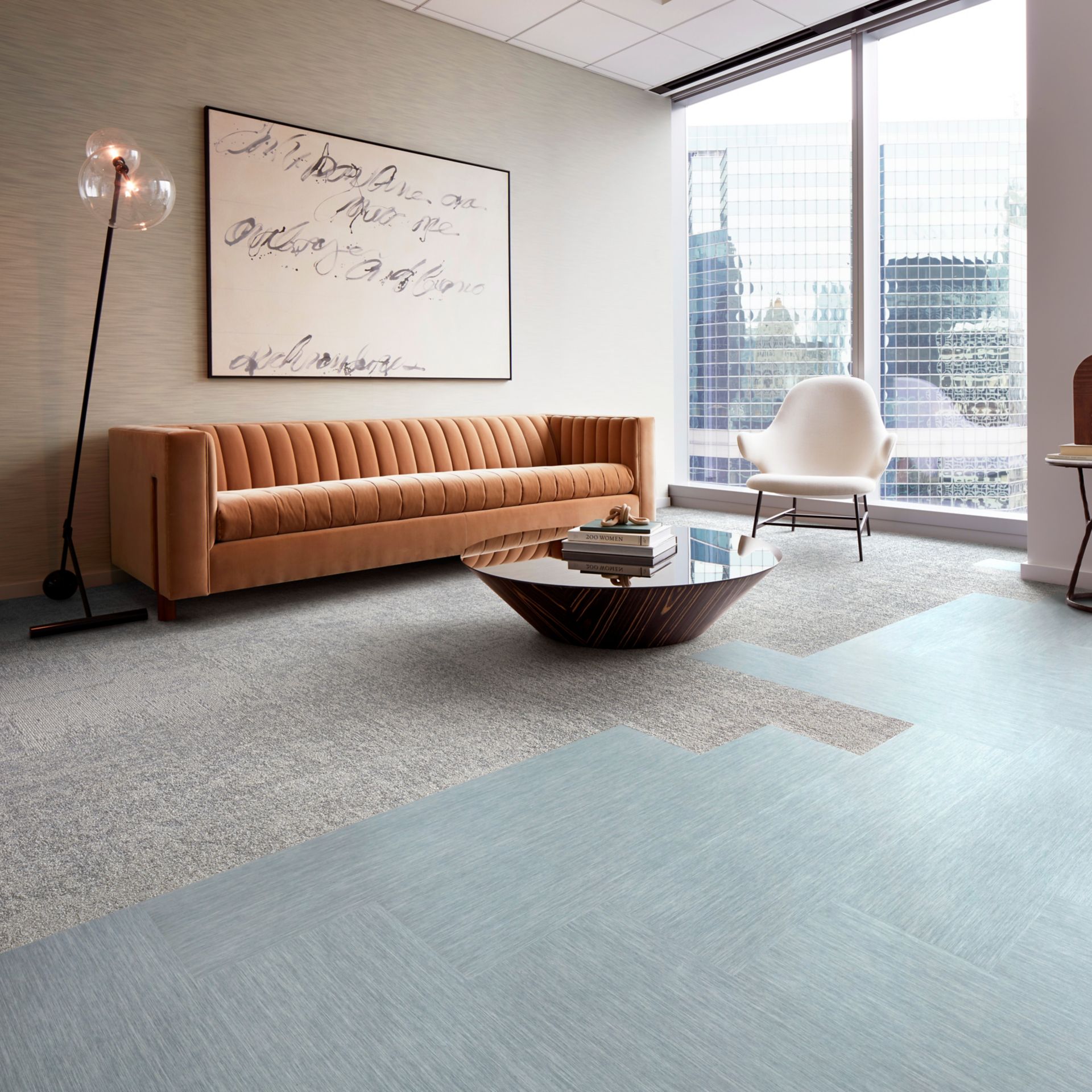 Interface Tokyo Texture carpet tile and Brushed Lines LVT in seating area with couch